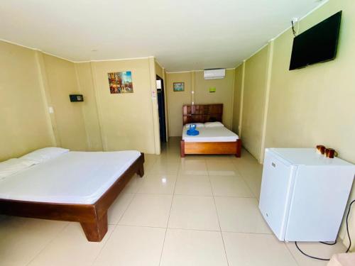 Кровать или кровати в номере Arenal Home