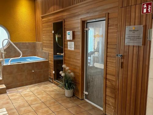 a bathroom with a bath tub in a building at Hotel Sonne Eintracht Achern in Achern