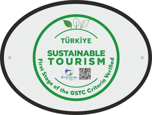 a label for the sustainable tourism initiative of the gst church at Deep Ocean Camping-Adults Only in Faralya