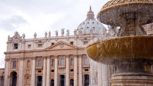 a water fountain in front of a large building at Gioiello Vaticano in Rome