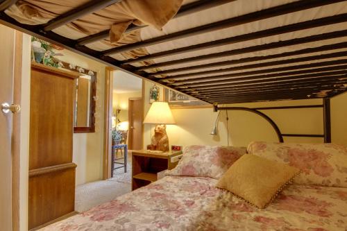 a bedroom with a bed and a wooden ceiling at Yellowstone Country Retreat Stunning Views! in Livingston