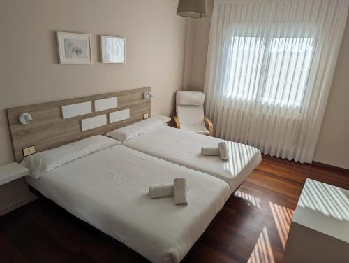 Postel nebo postele na pokoji v ubytování Apartamentos Turísticos Guillermo