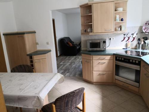 Kuchyň nebo kuchyňský kout v ubytování Pumphut's Scheune Ferienwohnungen Nr 5 - 9 Nähe Freizeitpark Plohn