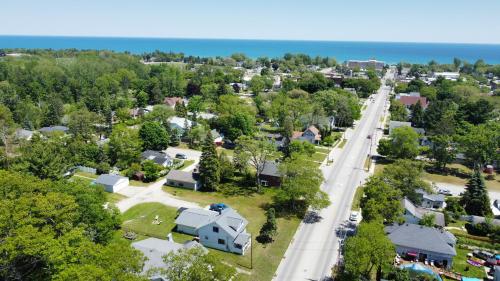 an aerial view of a town with a road at Oscoda Hilltop Haven - Great Location Near Beach! in Oscoda