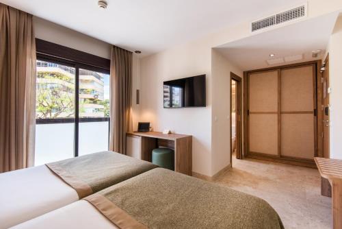 Katil atau katil-katil dalam bilik di Hotel Tarik