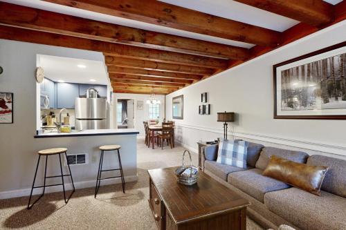 a living room with a couch and a table at Riverbend in Newry