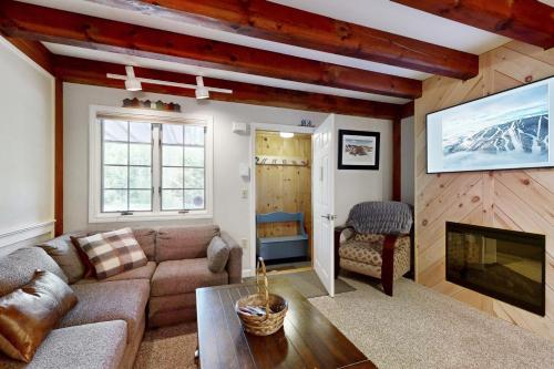a living room with a couch and a fireplace at Riverbend in Newry