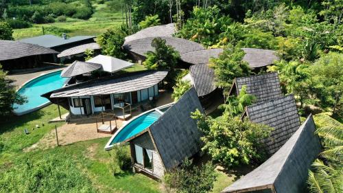 an aerial view of a resort with a swimming pool at Houttuyn Wellness River Resort in Paramaribo