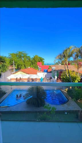 a view of a swimming pool from a balcony at Pousada Terra Nostra in Prado