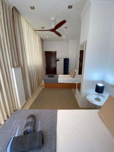 a bedroom with a bed with a camera on it at Marbella Beach Front Edificio Mayoral Centro Ciudad y Primera Línea Playa Muy Amplio y Espacioso in Marbella