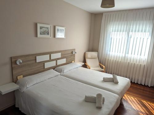 Postel nebo postele na pokoji v ubytování Apartamentos Turísticos Guillermo