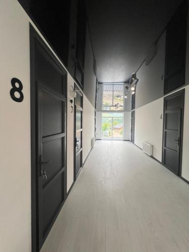 an empty hallway with an sign on the door at Готель WeLKoMe in Krivorovnya