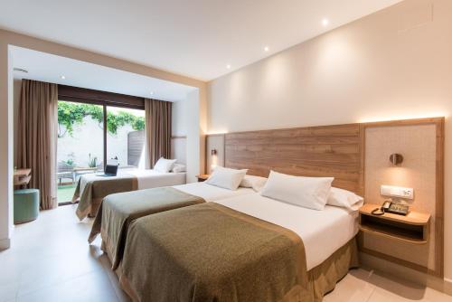 Katil atau katil-katil dalam bilik di Hotel Tarik