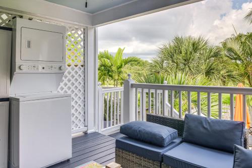 a porch with a couch and a stove at Key West Home on Golf Course with Patio and Grill! in Key West