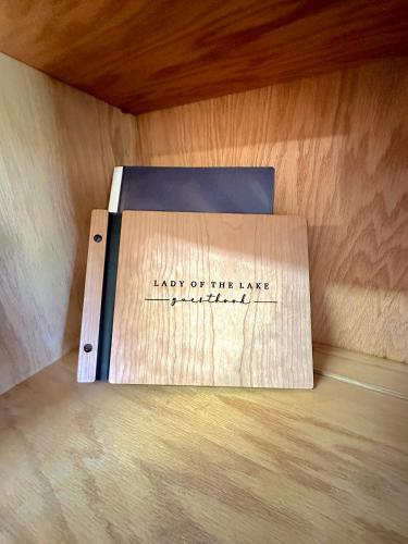a cardboard box sitting on top of a wooden table at Lady of the Lake in Chapin