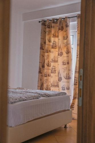 Postel nebo postele na pokoji v ubytování Casa Selimi