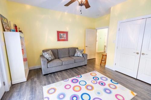 a living room with a couch and a rug at Voyage Anchor in Nags Head