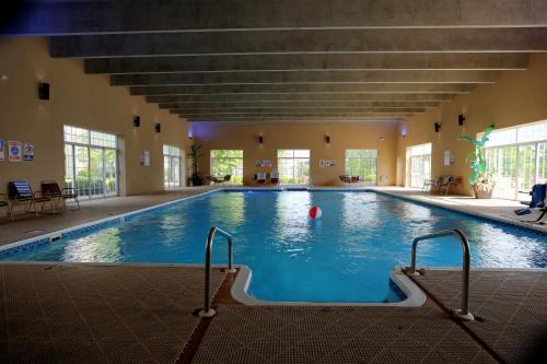 a large swimming pool with a ball in the middle at Grand Crowne Resort by Capital Vacations in Branson