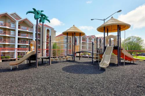 a playground at a resort with slides and swings at Grand Crowne Resort by Capital Vacations in Branson