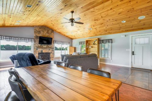 a dining room with a wooden table and chairs at Lakefront Vacation Rental about 10 Mi to Shipshewana! in Howe