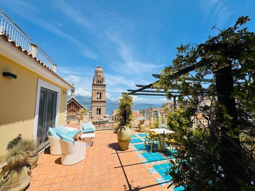 a balcony with a view of a clock tower at La Gaetana in Gaeta
