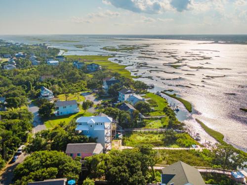 an aerial view of a beach with houses and the water at Just Another Day in Paradise in Surf City