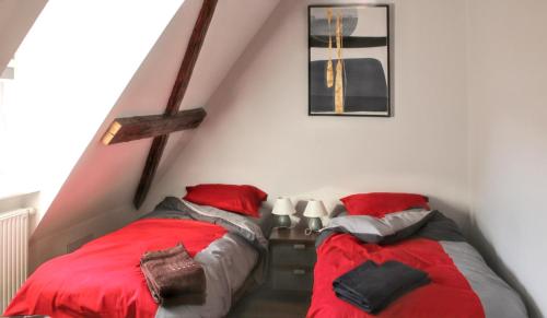 Postelja oz. postelje v sobi nastanitve Appartement de 3 chambres avec terrasse amenagee et wifi a Eguisheim