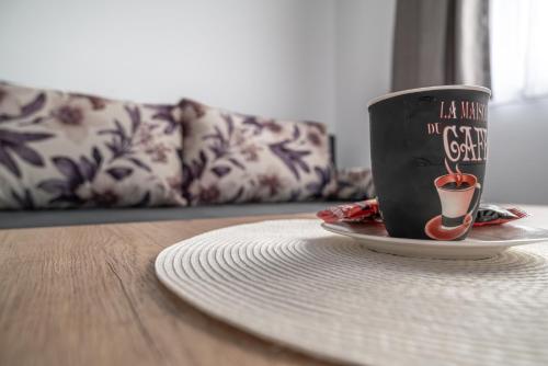 a coffee cup sitting on a plate on a table at Japods Kingdom in Bihać