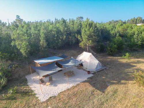 an overhead view of a tent in a field at Tente Glamping sans vis à vis, nature & calme, côte Vicentine in Rogil