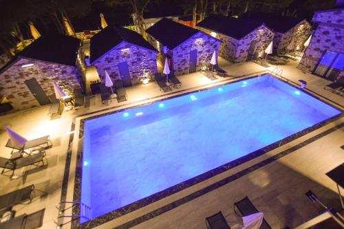 an overhead view of a swimming pool at night at Ağva Casa Rosa Bungalov Otel in Sile