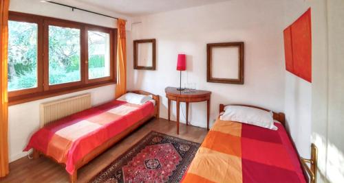 Postel nebo postele na pokoji v ubytování Maison de 2 chambres avec jardin clos et wifi a Reignier Esery