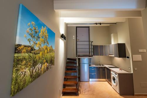 Kuchyň nebo kuchyňský kout v ubytování ArcoLoBello B&B ApartHotel