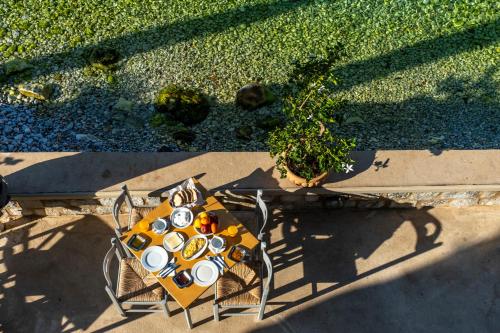 an overhead view of a table with cups on it at Akroyiali - Guesthouse in Gerolimenas