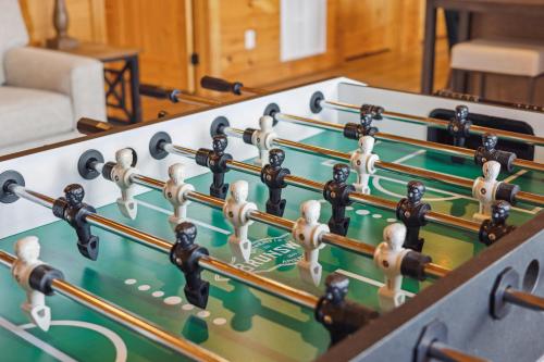 a row of dominoes in a room at Oakley Lodge: Luxury Cabin w/ MTN Views Indoor Pool • Hot Tub in Sevierville