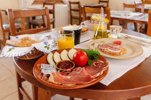a table with a plate of food on it at Finca es Rafal, Agroturisme in Montuiri