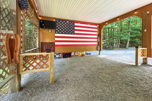 an american flag on the wall of a house at Adirondack Oasis Private Lake, Sauna, and Fire Pit in Chestertown