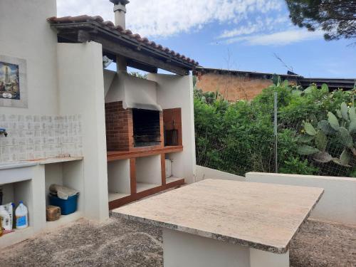 a patio with a table in front of a building at Belvedere in Santa Margherita di Belice