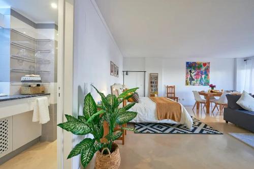 a bedroom with a bed and a living room at Modern apartment with garage and pool in Lisbon