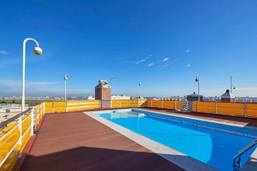 a swimming pool on the roof of a building at Modern apartment with garage and pool in Lisbon