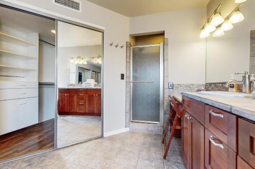 a bathroom with a shower and a sink at Sonoran Oasis in Mesa