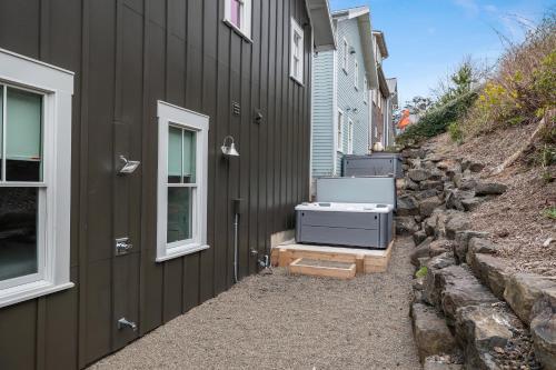 a building with a bath tub on the side of it at Solitude by Seabrook Hospitality in Pacific Beach