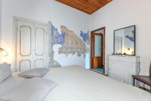 En eller flere senge i et værelse på Casina vintage - Rio Marina