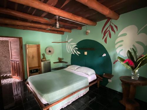 Una cama o camas en una habitación de Hotel Entre Dos Aguas