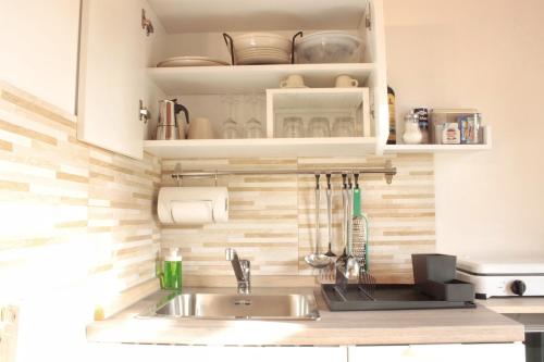 a kitchen with a sink and a counter top at La Casa dei Mori in Siracusa