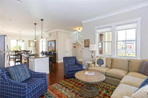 a living room with a couch and chairs and a table at Shifting Gears by Seabrook Hospitality in Pacific Beach