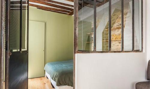 Posteľ alebo postele v izbe v ubytovaní The 199 - Charming apartment in the heart of Paris