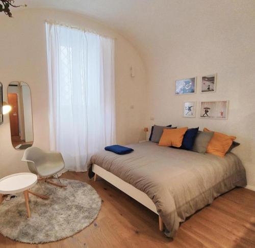 a bedroom with a large bed and a window at IN URBS in Salerno