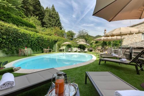 a swimming pool in the backyard of a house at Locanda Senio in Palazzuolo sul Senio
