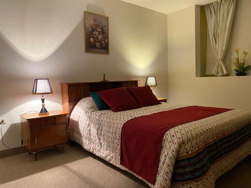 En eller flere senge i et værelse på Villa San Jose