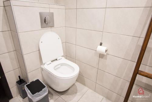 a bathroom with a toilet with a roll of toilet paper at Sea Side House in Nea Chili